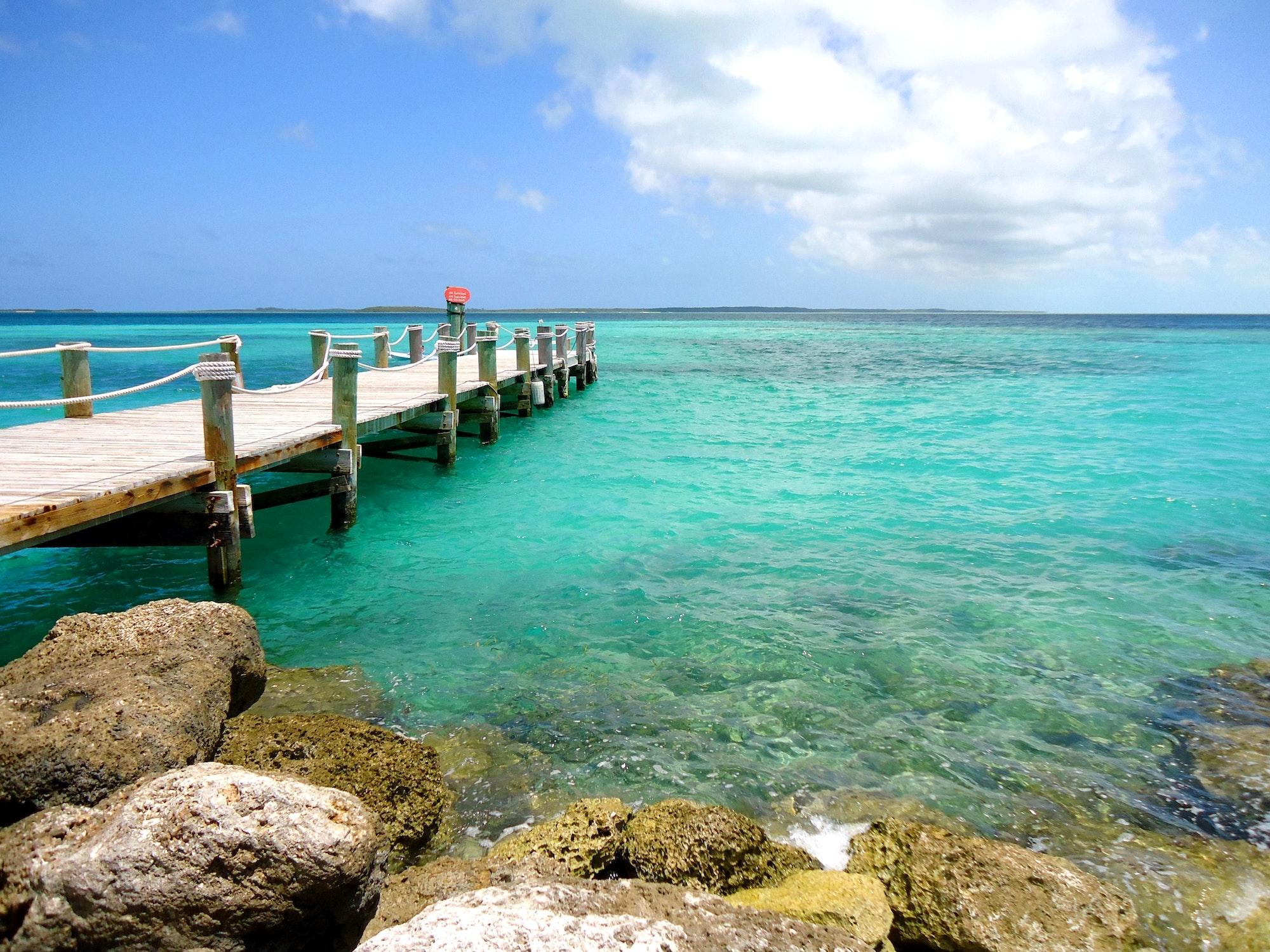 Pier into the turquoise waters of an island Paradise in the Bahamas, Caribbean Sea