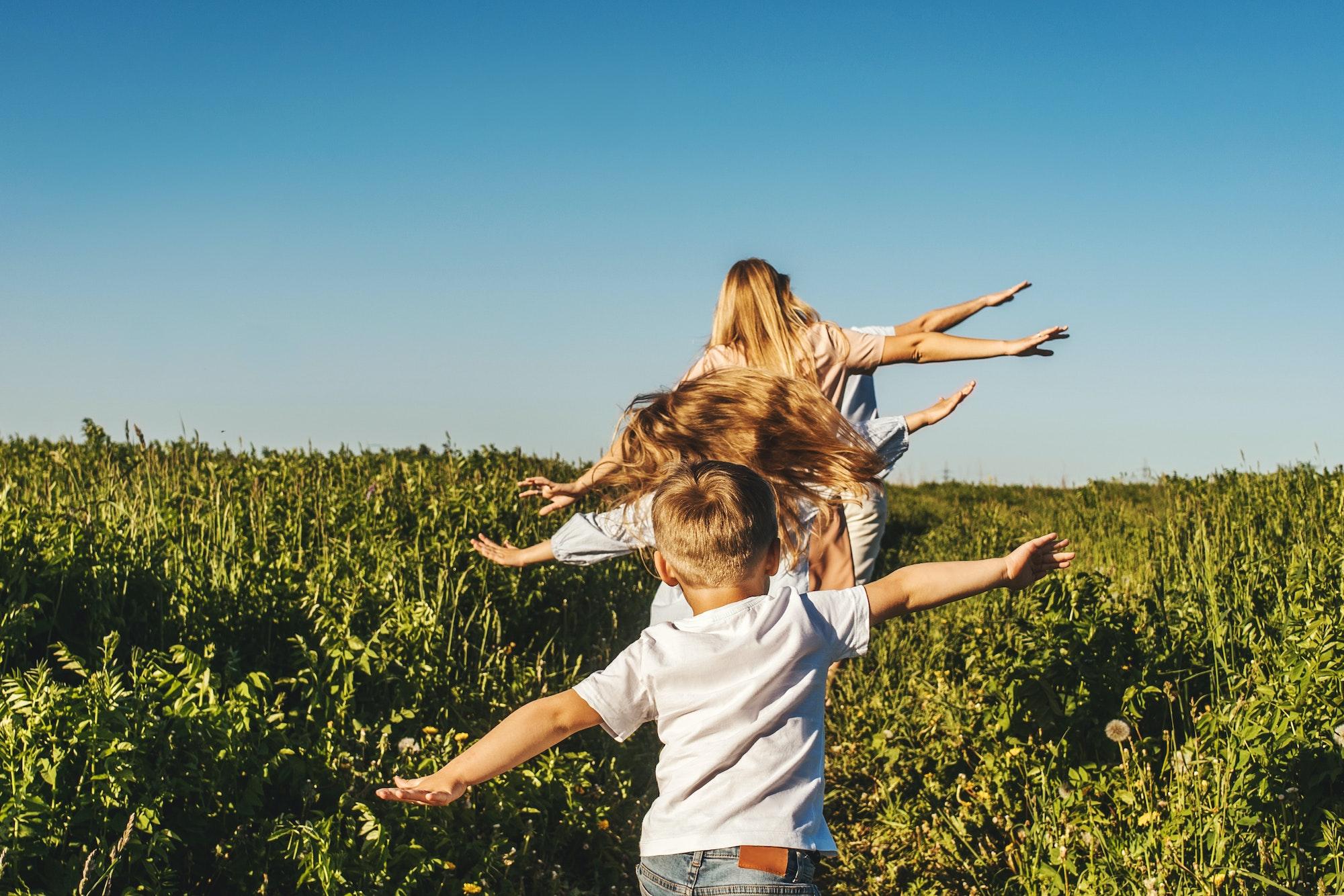 Happy family like planes in field.