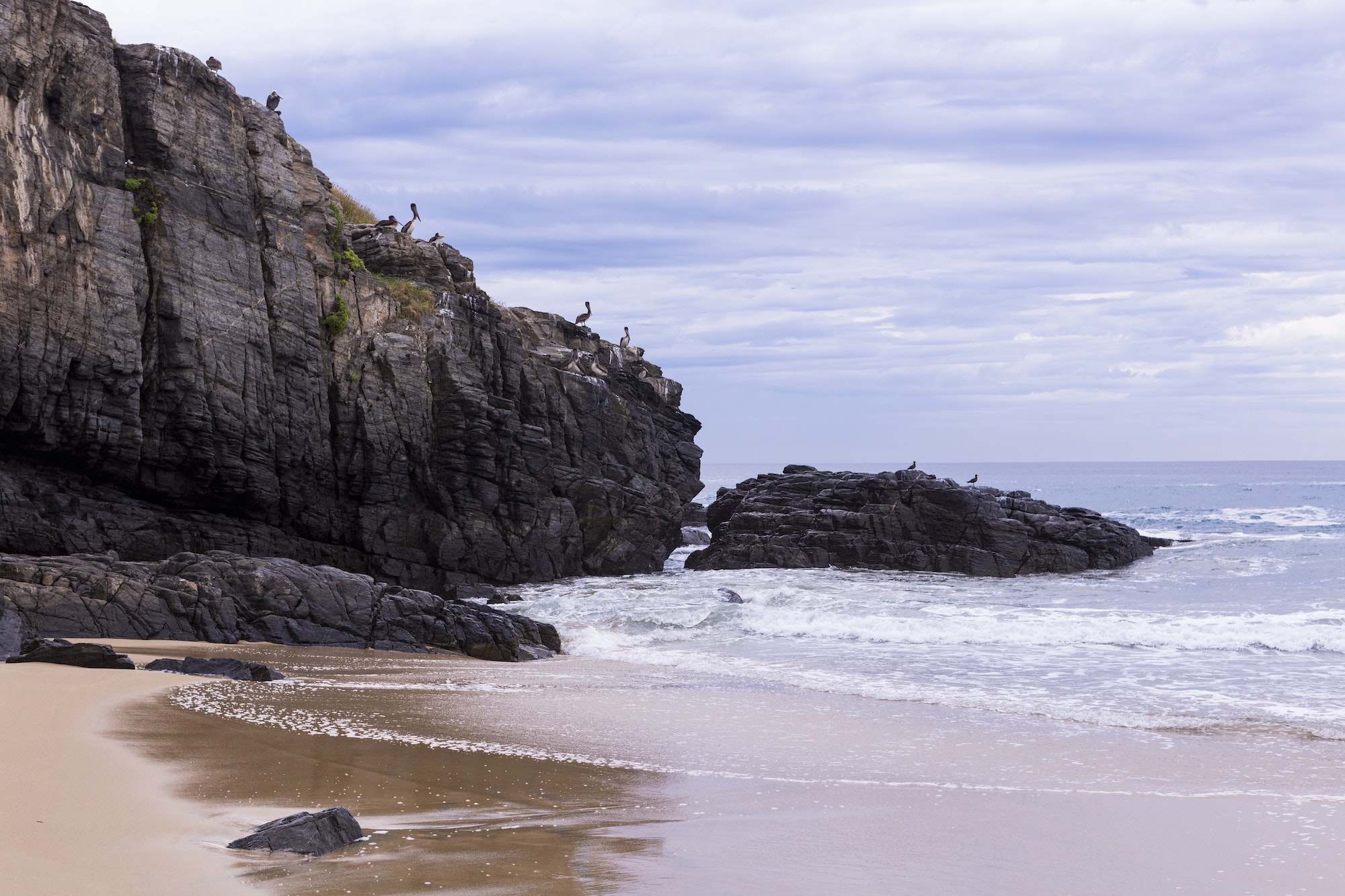 Sandy beach and rocks, Todos Santos, Mexico.