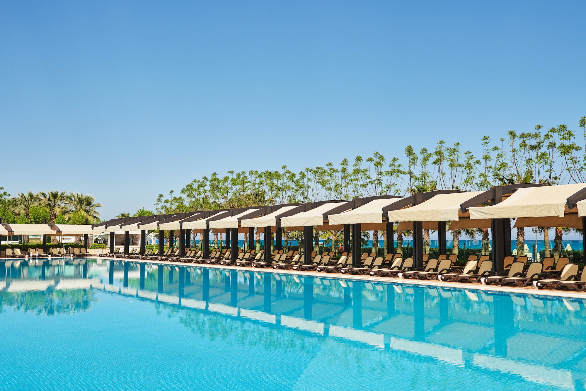 Swimming pool and beach of luxury hotel. Type entertainment complex. Amara Dolce Vita Luxury Hotel