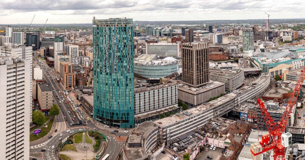 Aerial view of Birmingham’s skyline featuring the Radisson Blu Hotel, where guests can earn or redeem Radisson Rewards points.