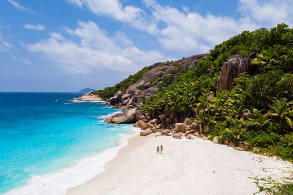Panoramic view of a British Virgin Islands bay, showcasing anchored yachts and lush hills, perfect for a BVI all-inclusive, adults-only escape vacation.