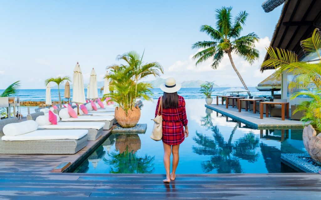 Panoramic view of a British Virgin Islands bay, showcasing anchored yachts and lush hills, perfect for a BVI all-inclusive, adults-only escape vacation.