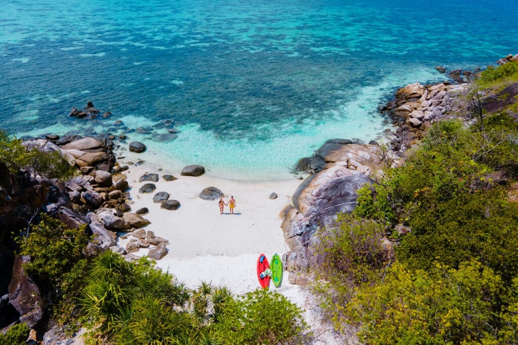 Panoramic view of a British Virgin Islands bay, showcasing anchored yachts and lush hills, perfect for a BVI all-inclusive, adults-only escape vacation.