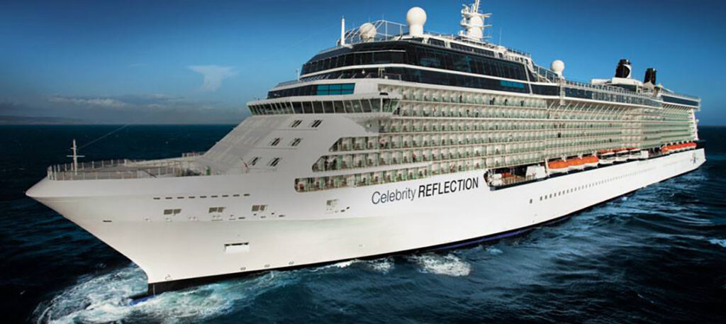 An exterior side view of the Celebrity Reflection cruise ship gliding through deep blue ocean waters under a clear sky. This Solstice-class vessel offers premium accommodations, including the exclusive Celebrity Retreat area, which provides suite guests with private lounges, dedicated dining, and upscale amenities.