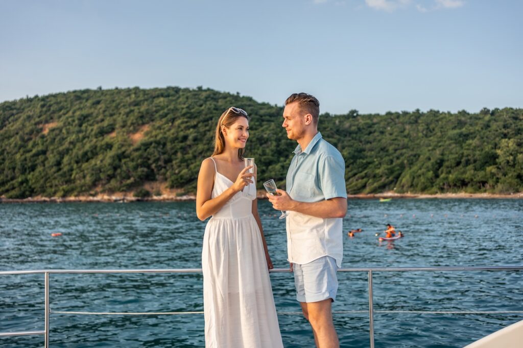 View of a European city and river at dusk, representing the dressy attire needed for an elegant dinner or evening event on board the ship.