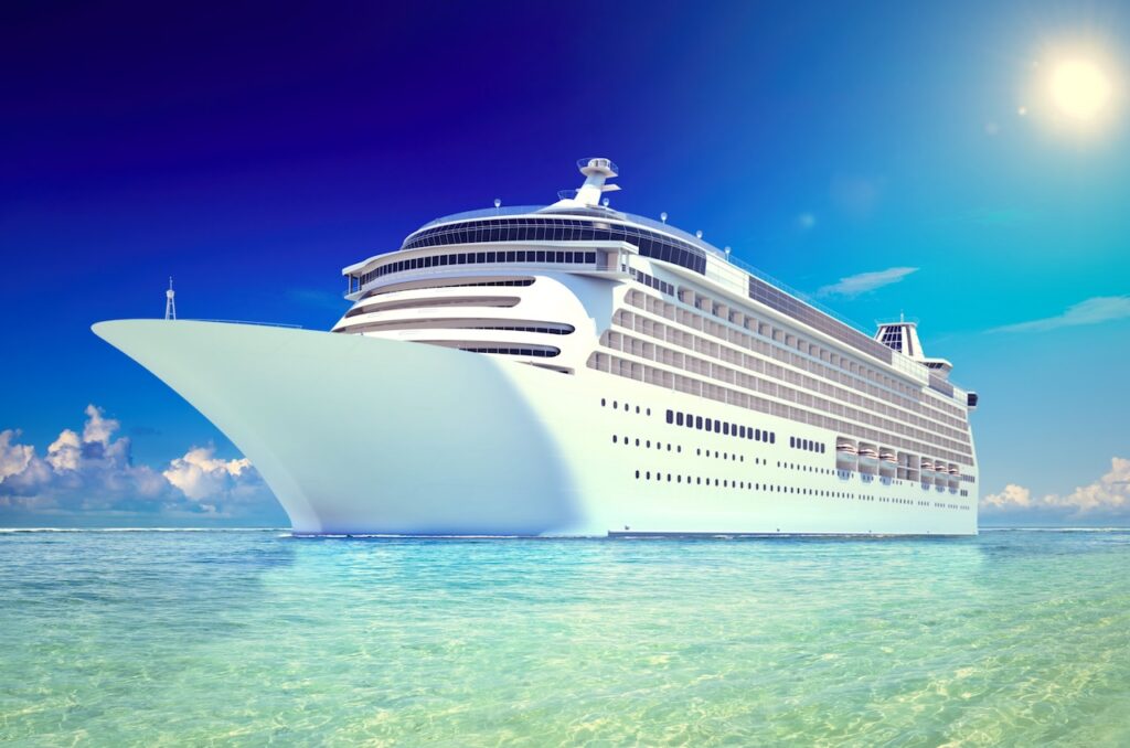 A luxury cruise ship with rows of private verandas sailing into a dramatic sunset, symbolizing the beautiful, luxurious days expected on a World Cruise.