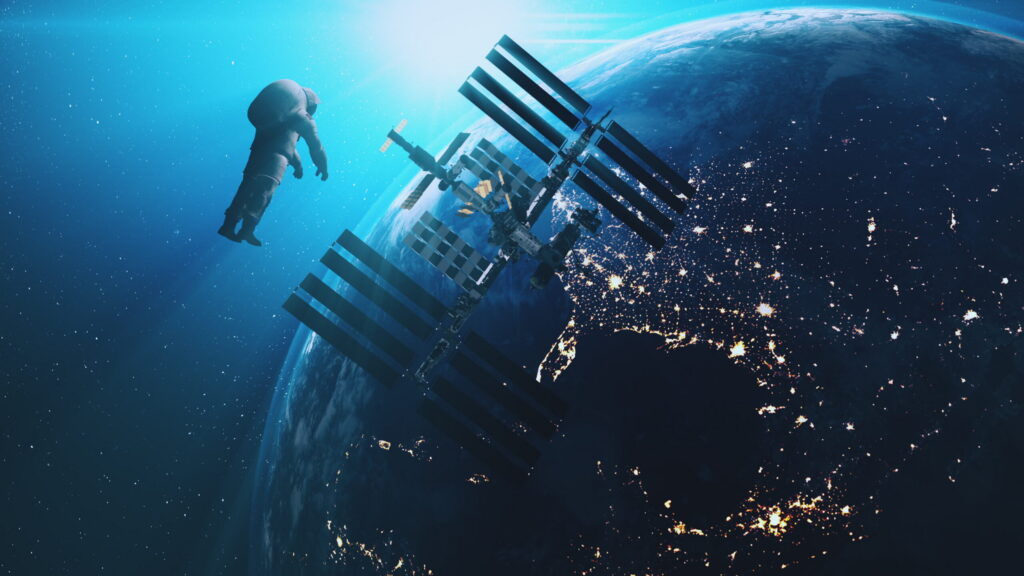 International Space Station ISS orbiting Earth with a Virgin Galactic vessel in suborbital flight against the horizon.