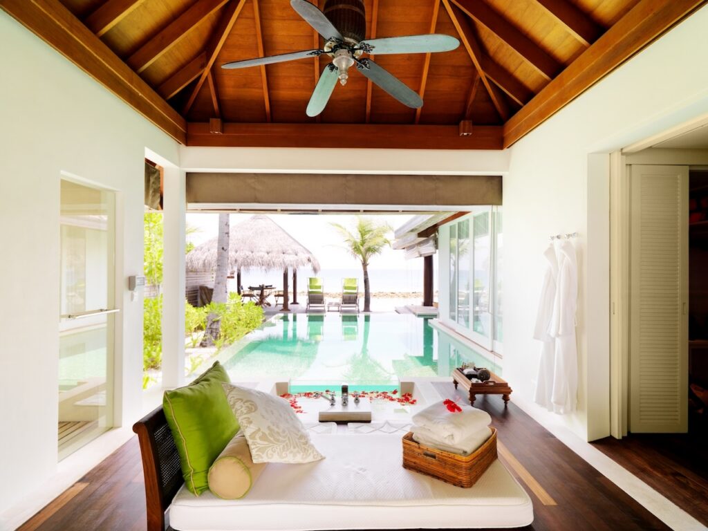 Luxury villa room opening to a private plunge pool, representing exclusive all-inclusive accommodations for an adults-only British Virgin Islands escape.