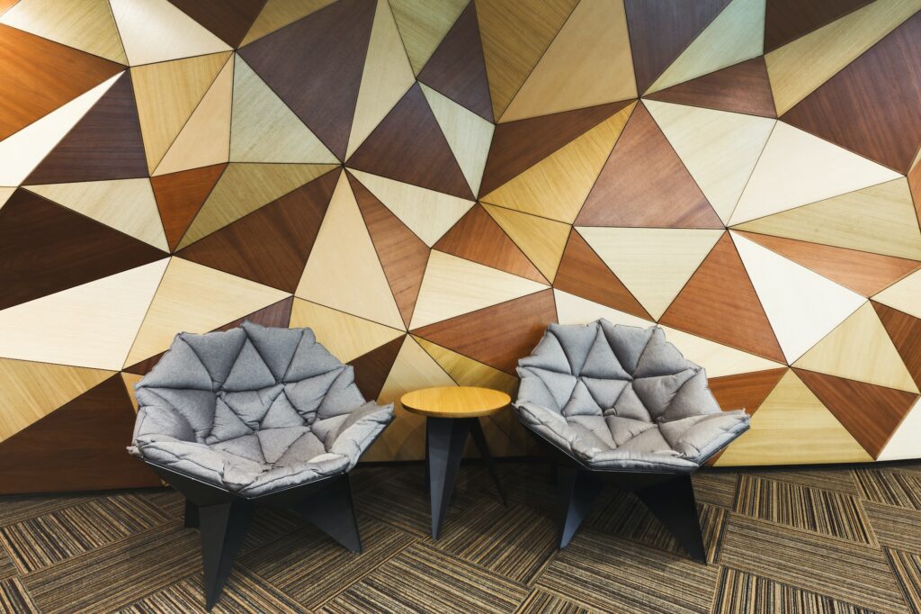 Luxury king suite at Marriott Bonvoy hotels with geometric wood paneling.
