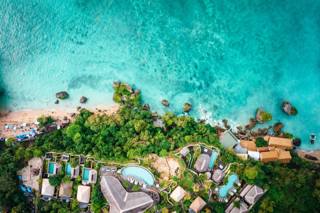 Panoramic view of a British Virgin Islands bay, showcasing anchored yachts and lush hills, perfect for a BVI all-inclusive, adults-only escape vacation.