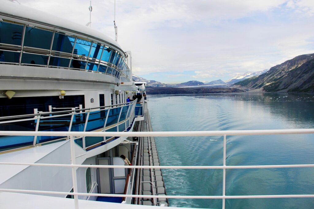 Luxury cruise ship sailing through calm waters on scenic Alaska cruise itineraries.