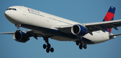 A large commercial aircraft from a major carrier in mid-flight, representing the global connectivity offered through a premier airline alliance.