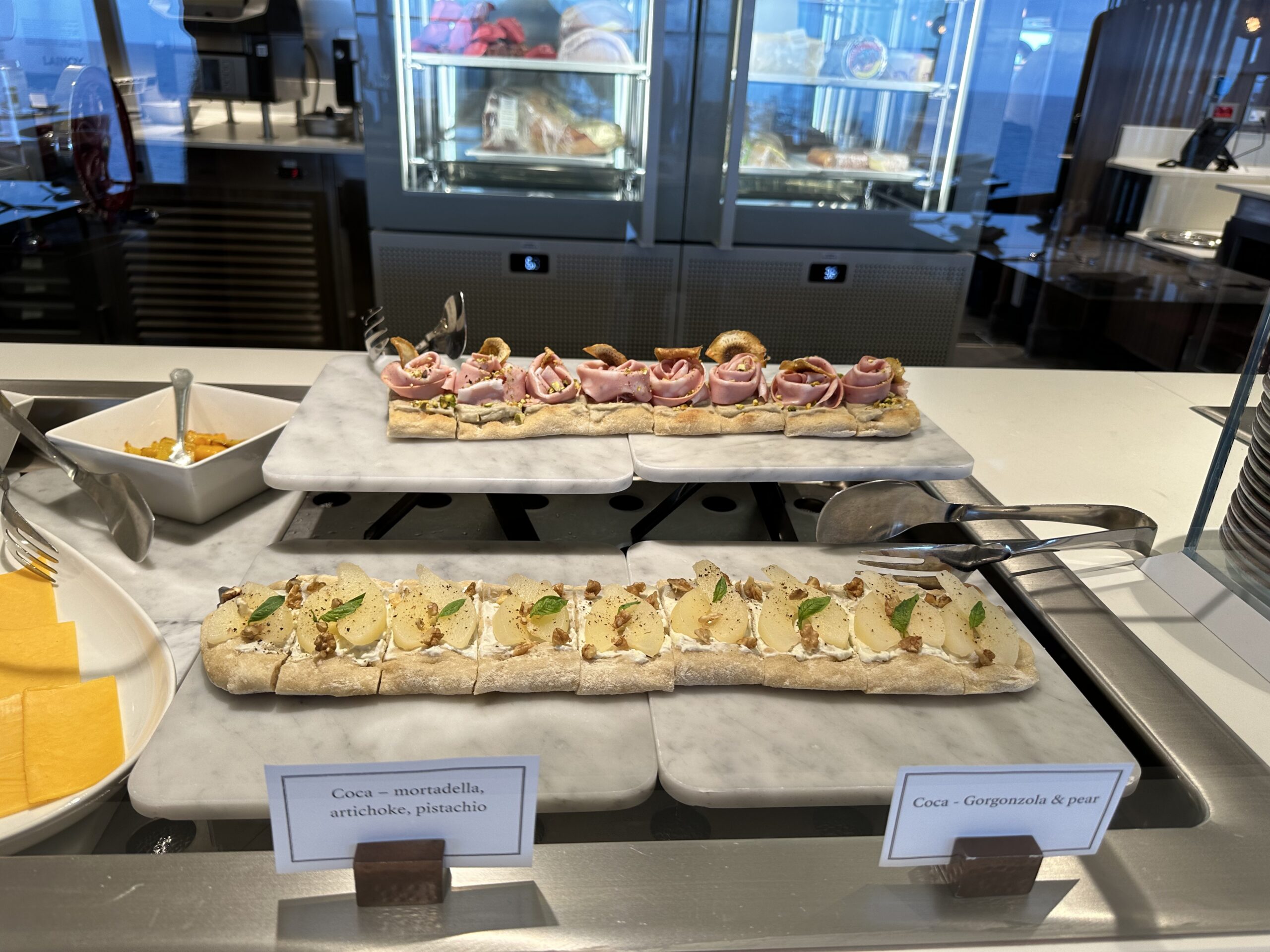 Charcuterie and flatbread station at Emporium Marketplace aboard Explora Journeys