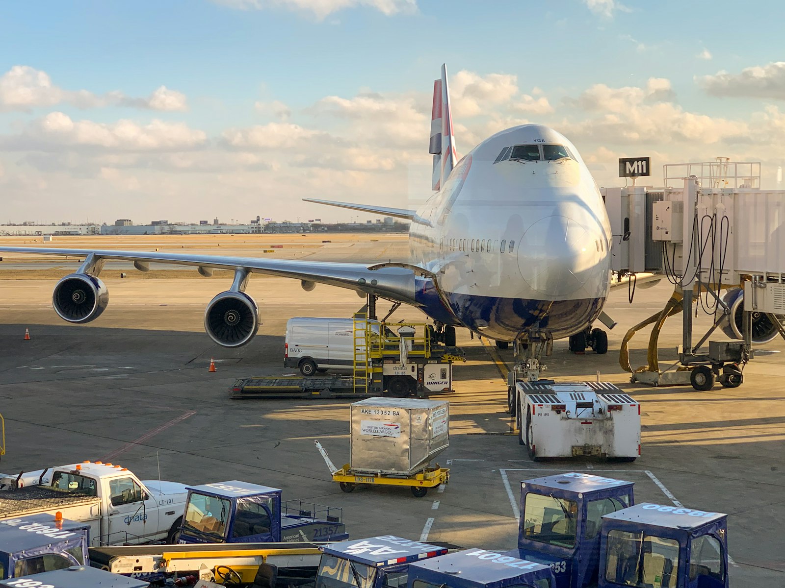 A wide-body airliner parked at an airport gate, the kind of aircraft frequent flyers redeem miles to fly.