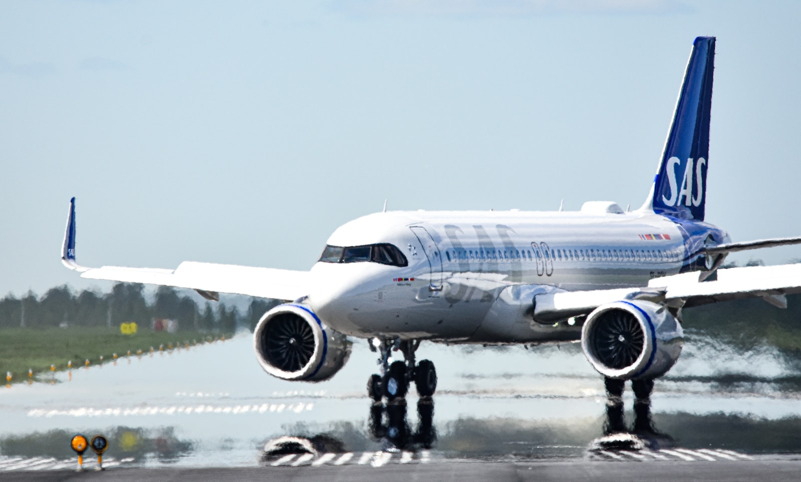 A commercial jetliner on the airport tarmac.